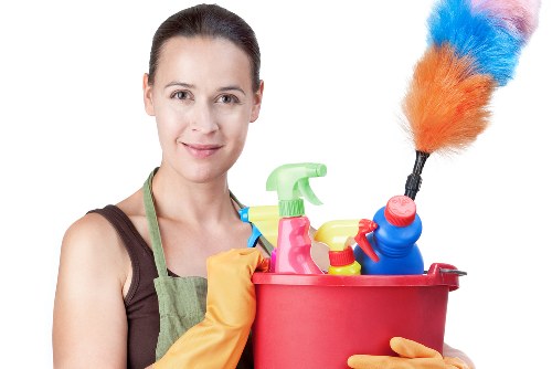Professional carpets cleaner in Crystalpalace deep cleaning a living room carpet