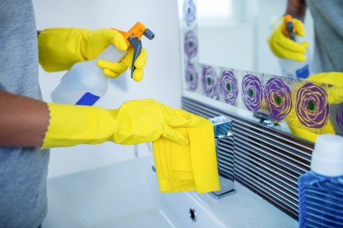 Team member managing workplace safety during cleaning